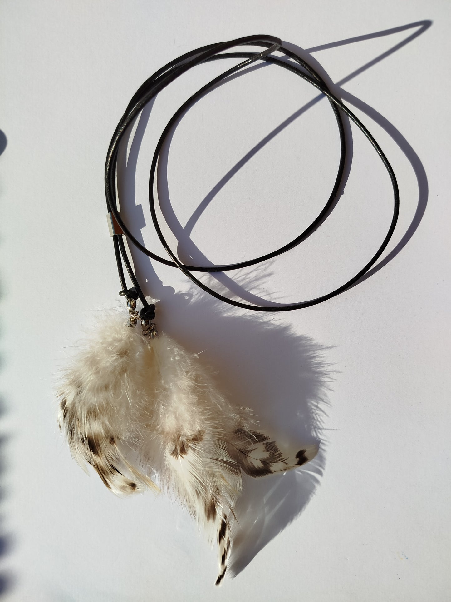 Collarino con piume
